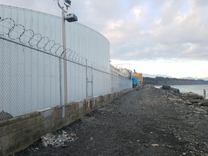 Industrial chain link on concrete wall for Tesoro